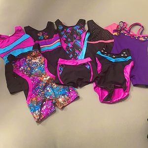 7 Gymnastics Leotards. Size 4/5.